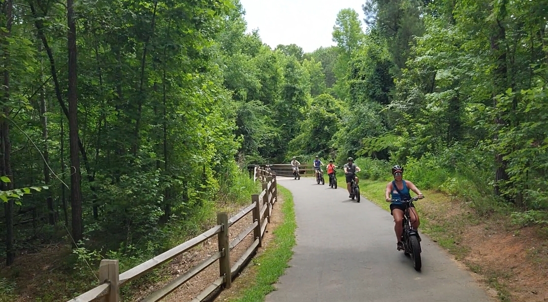 Triangle Adventures guests exploring Raleigh by e-bike
